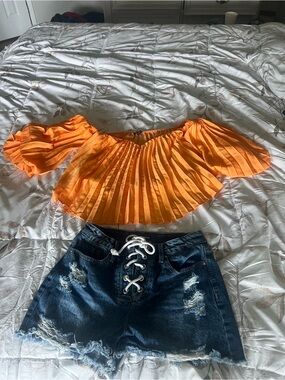 Bright Orange Pleated Off-Shoulder Women’s Top and denim shorts